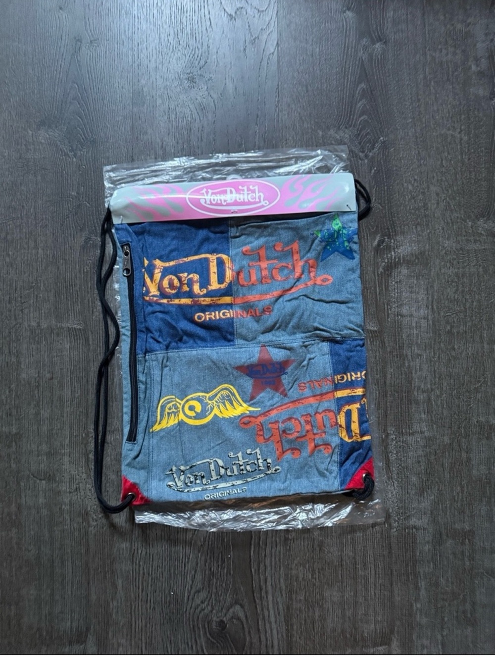 Von Dutch Patchwork Denim Logo Drawstring Backpack in Blue and Red Accents